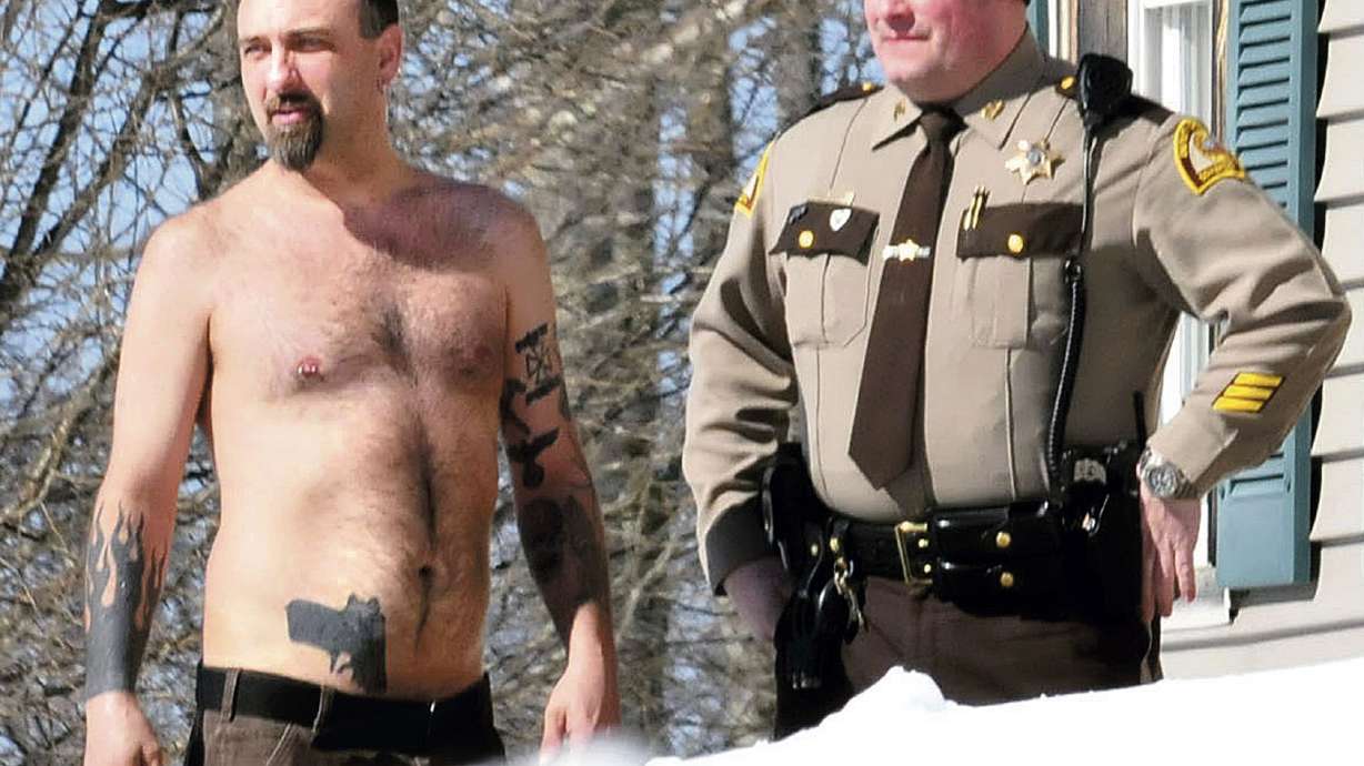Cop: Man with gun tattoo had real gun in waistband