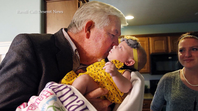 Ken Gardner holds baby Hannah, the child of Nick and Caroline
Longshore. Ken Gardner was the recipient of Nick Longshore's heart
after he passed away.