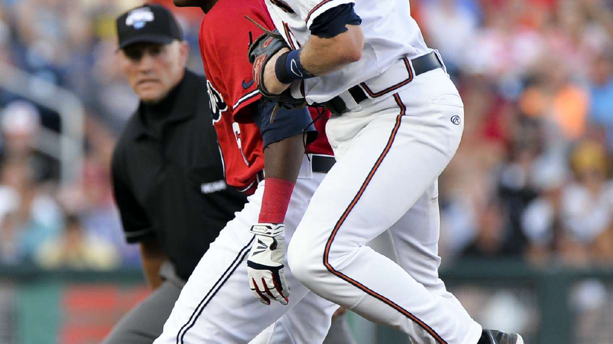 Rebels lose 2-1 to Virginia in CWS on hit in 9th
