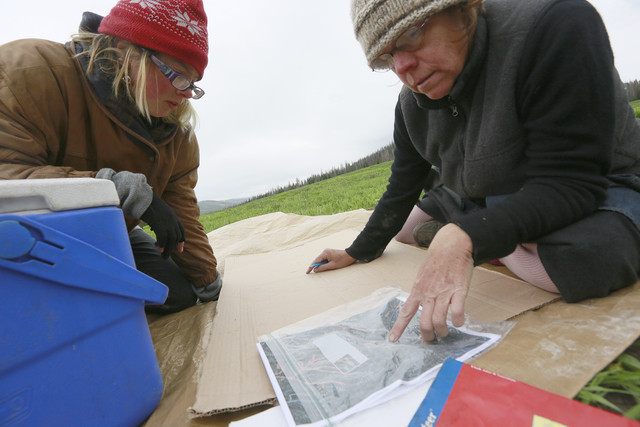 "Mint," left and "Sibling" draw a map for the event on Forest Service 
lands for the upcoming annual Rainbow Family of Living Light 
gathering on Tuesday, June 17, 2014, outside of Heber City. (Photo: 
Hugh Carey, Deseret News)