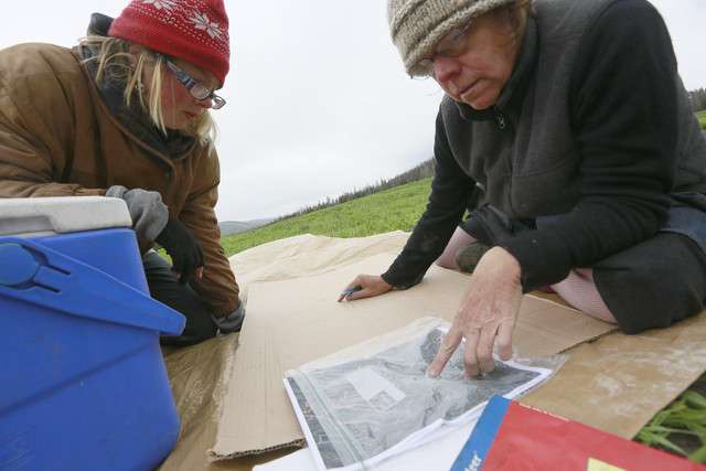 "Mint," left and "Sibling" draw a map for the event on Forest Service
lands for the upcoming annual Rainbow Family of Living Light
gathering on Tuesday, June 17, 2014, outside of Heber City. (Photo:
Hugh Carey, Deseret News)