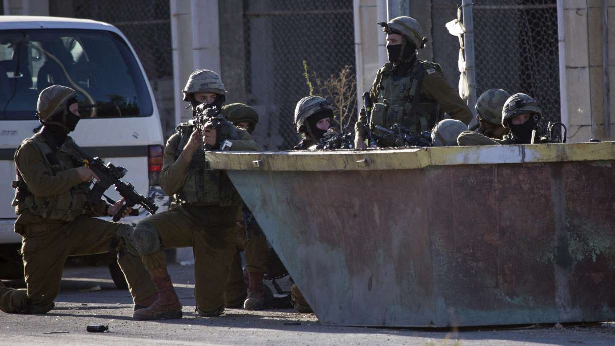 Palestinian leader defends cooperation with Israel