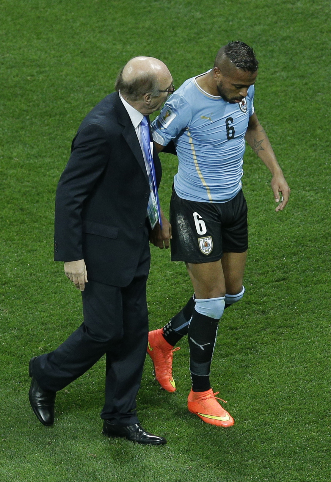 Uruguay player stays in game after head injury