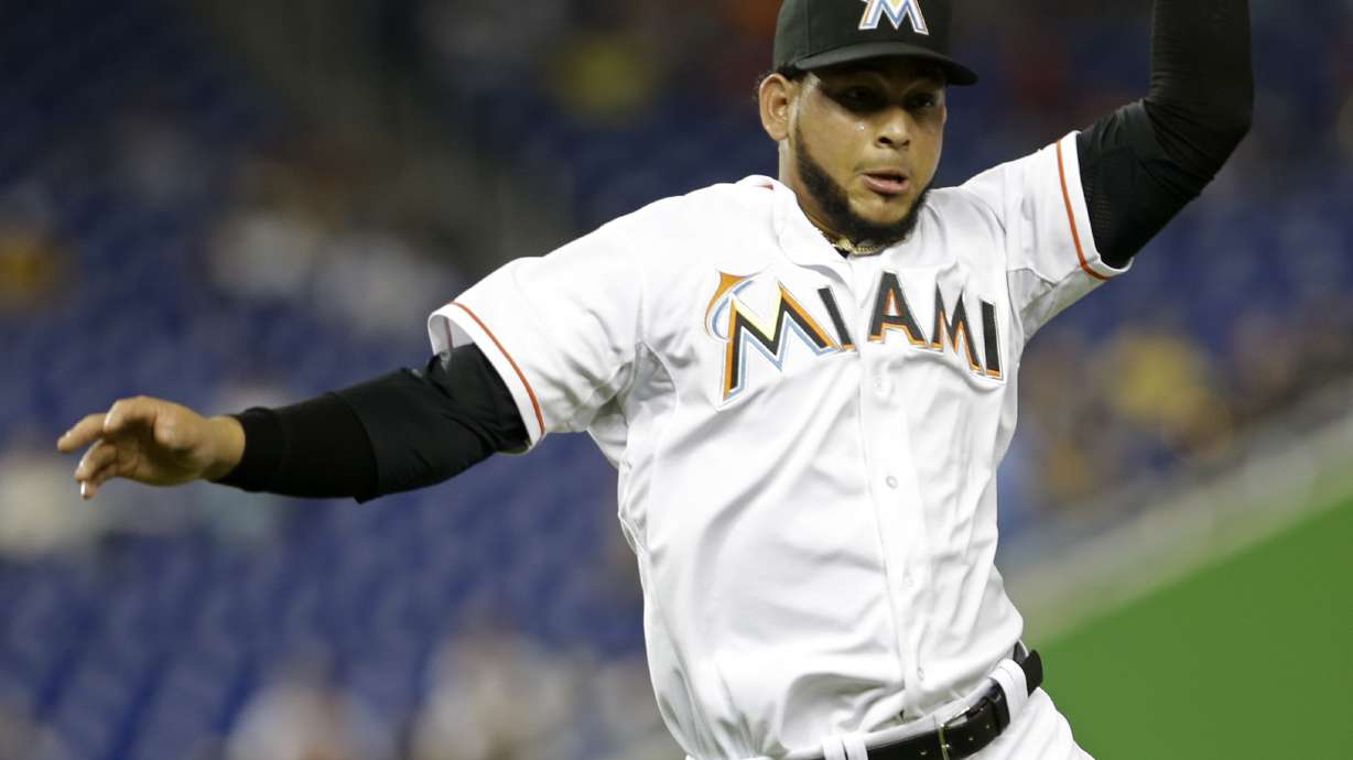 Ozuna cuts down tying run twice in Marlins 3-2 win