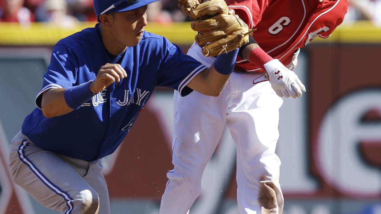 Reds hold onto big lead for 11-1 win over Jays