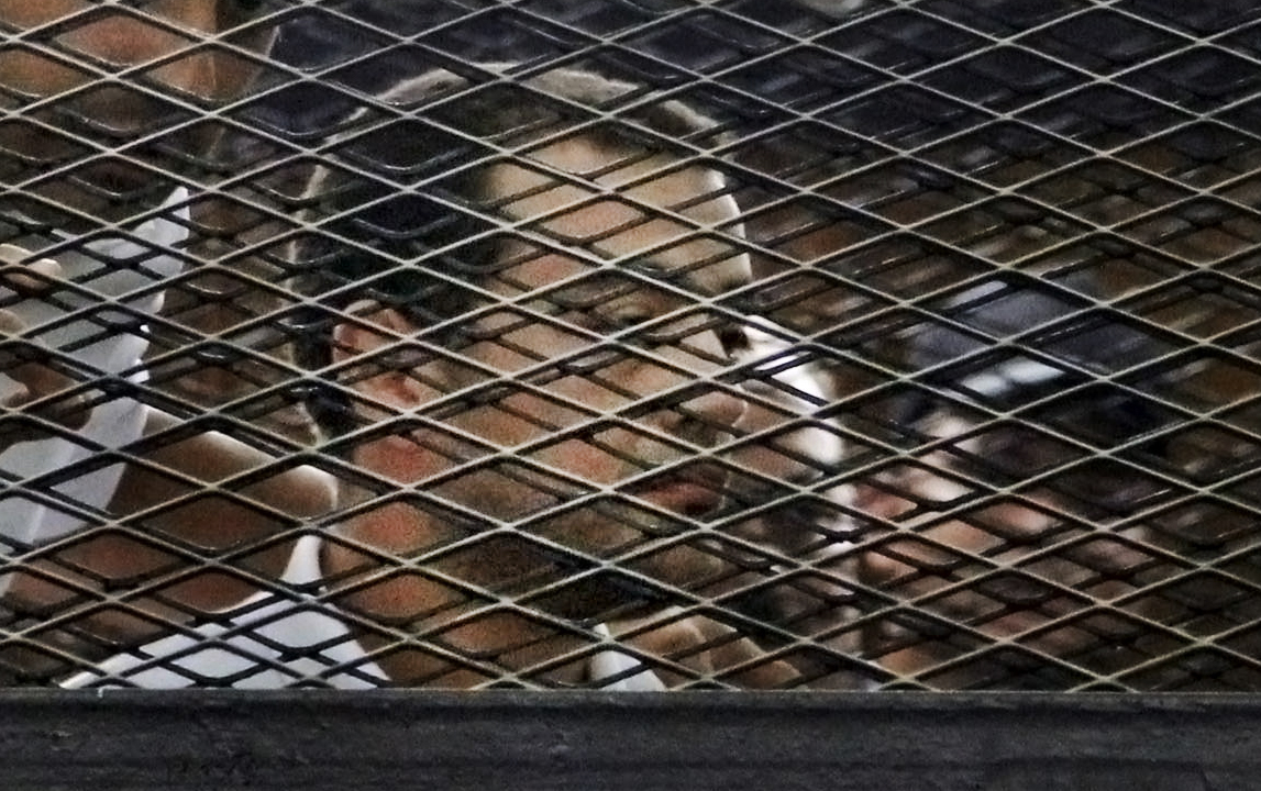 Thumbnails of the 3 jailed Al-Jazeera journalists