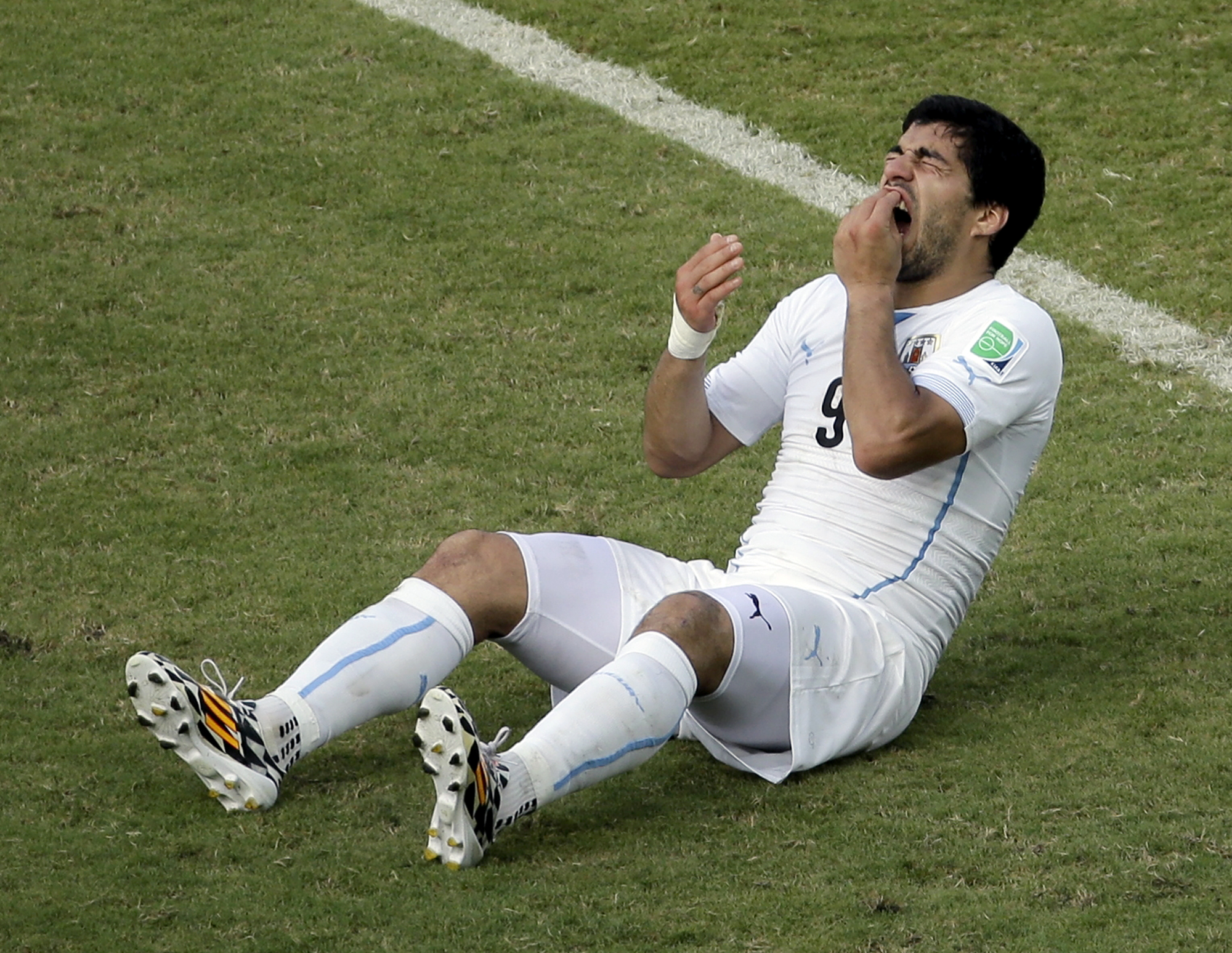 FIFA charges Luis Suarez for biting in World Cup