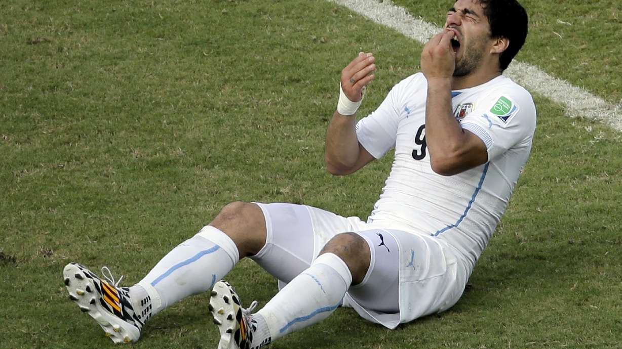 FIFA charges Luis Suarez for biting in World Cup