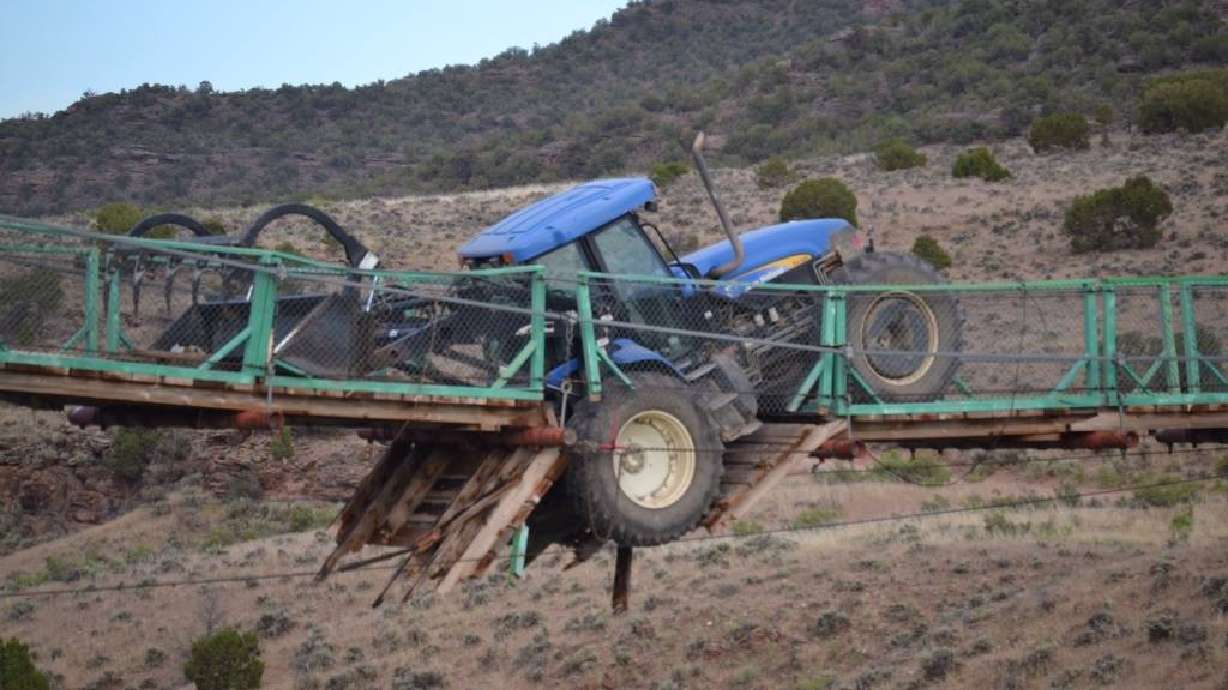 Tractor becomes stuck on swinging bridge in Colo.