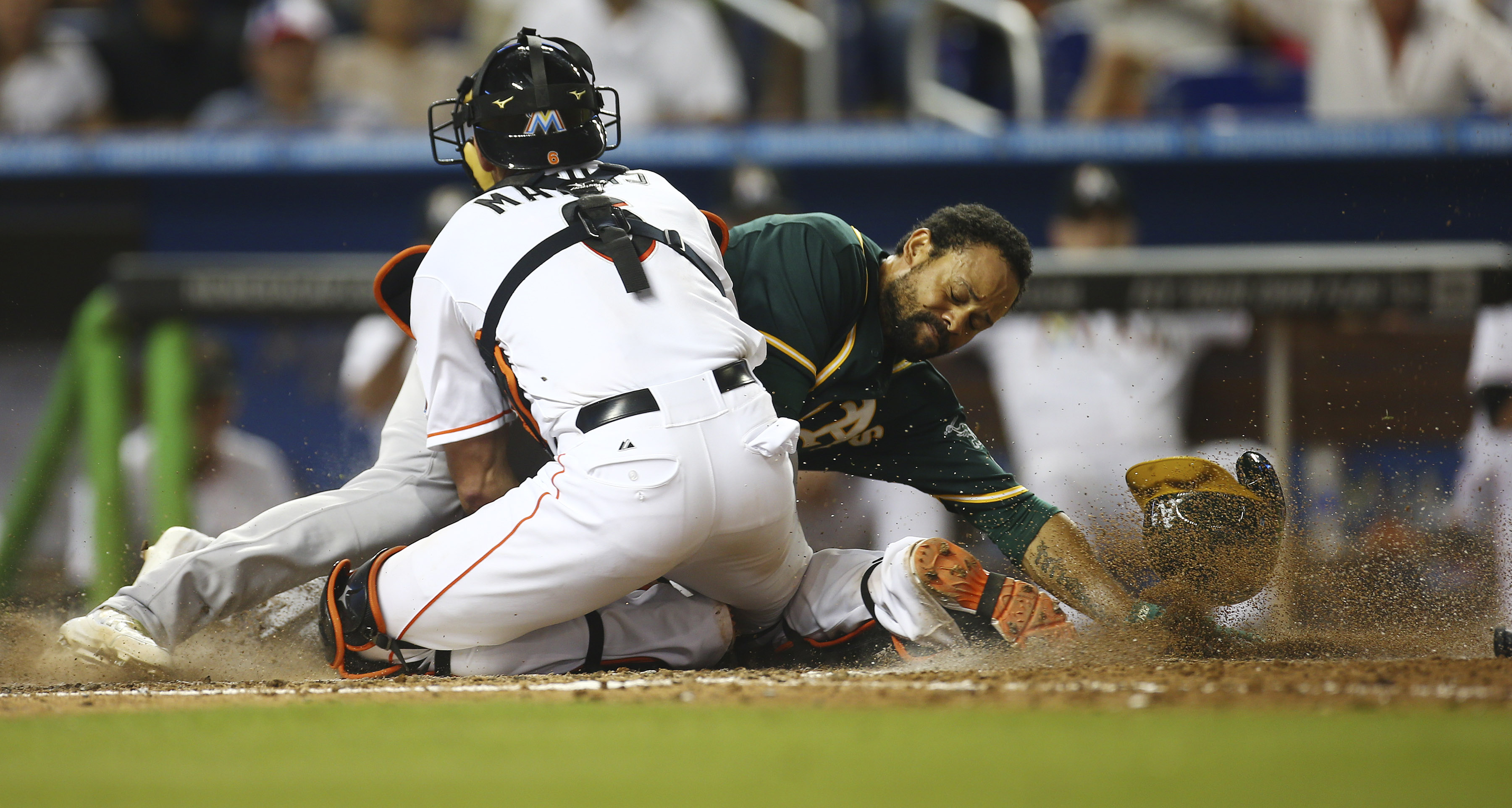 Marlins give up 4 in 9th and lose to A's 9-5