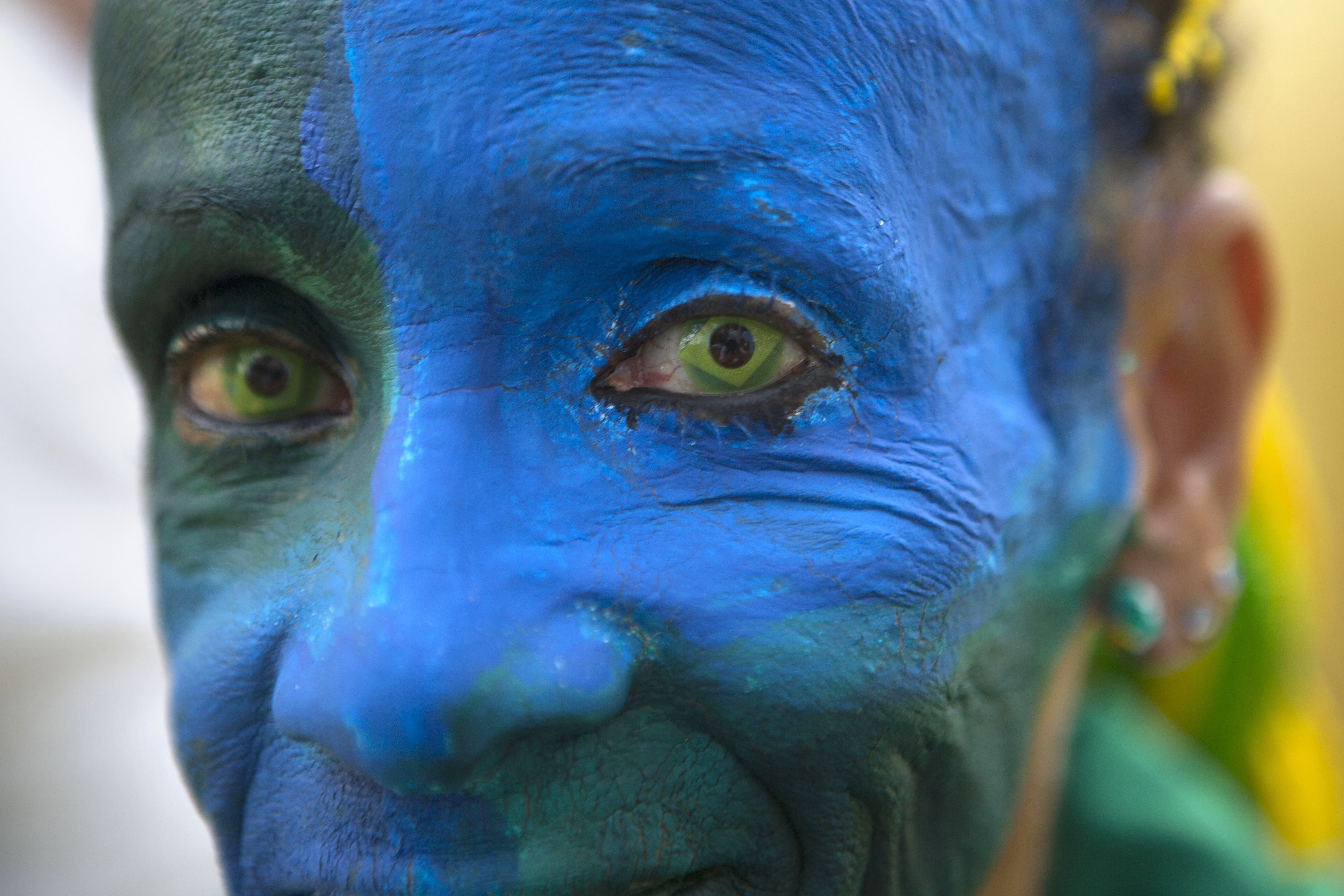 AP PHOTOS: Die-hard fans bring color to World Cup