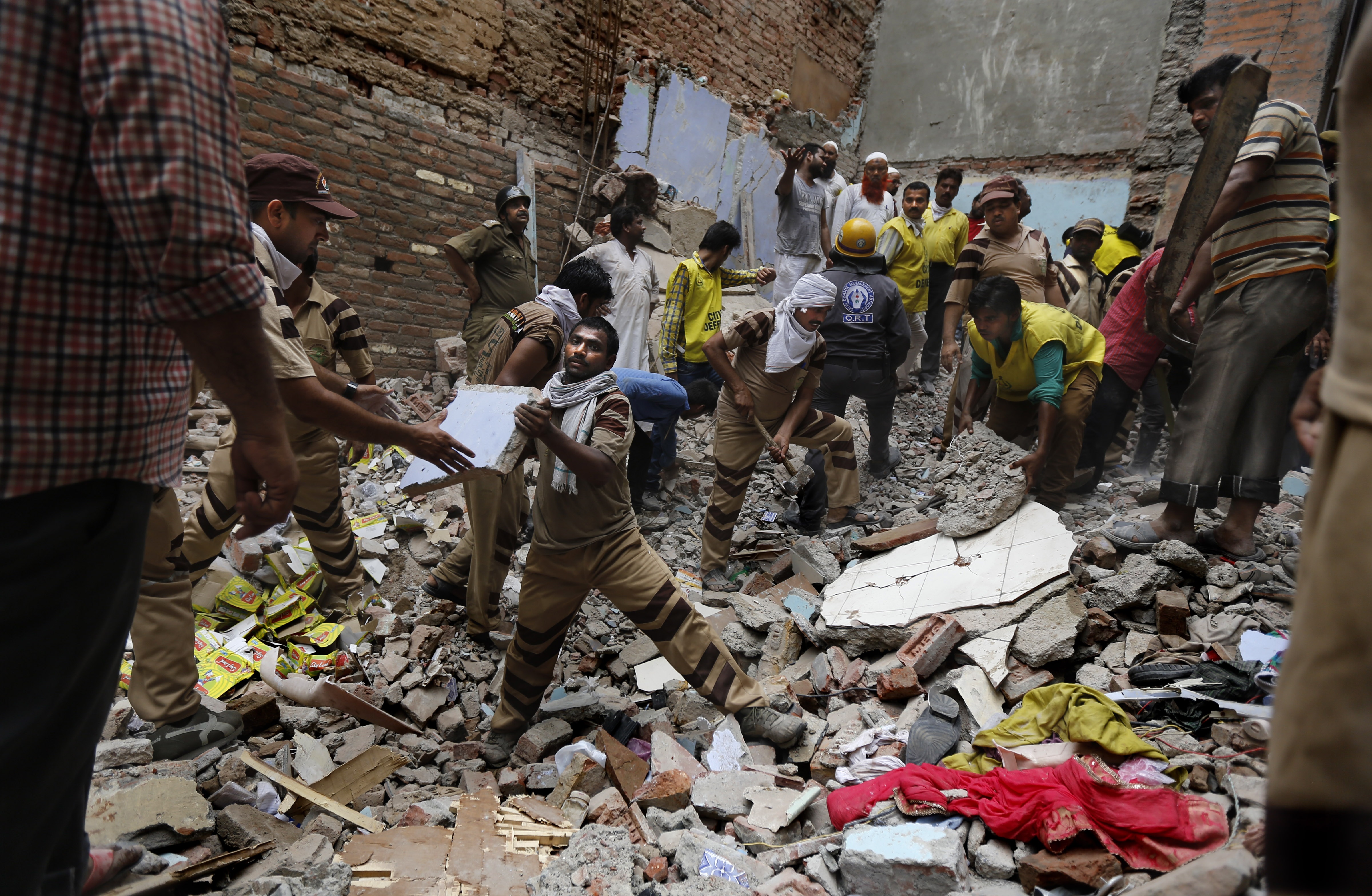 2 buildings topple in India, killing at least 19