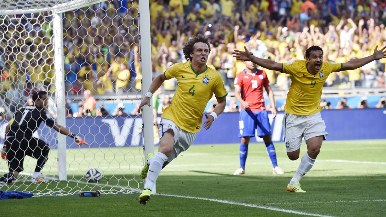 Saved by the woodwork, Brazil lives another day