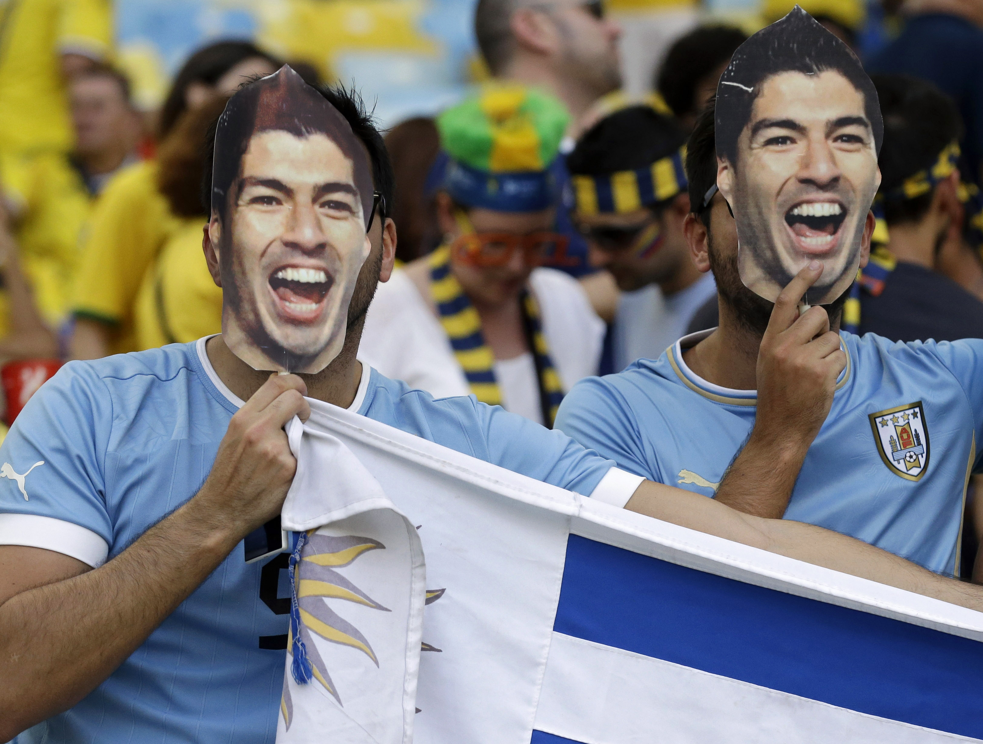 Suarez idolized, not blamed for Uruguay's exit