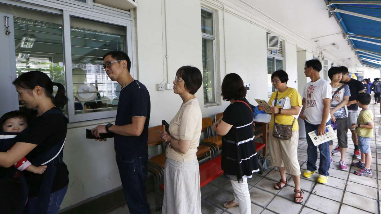 Big turnout in HK democracy vote as Beijing fumes