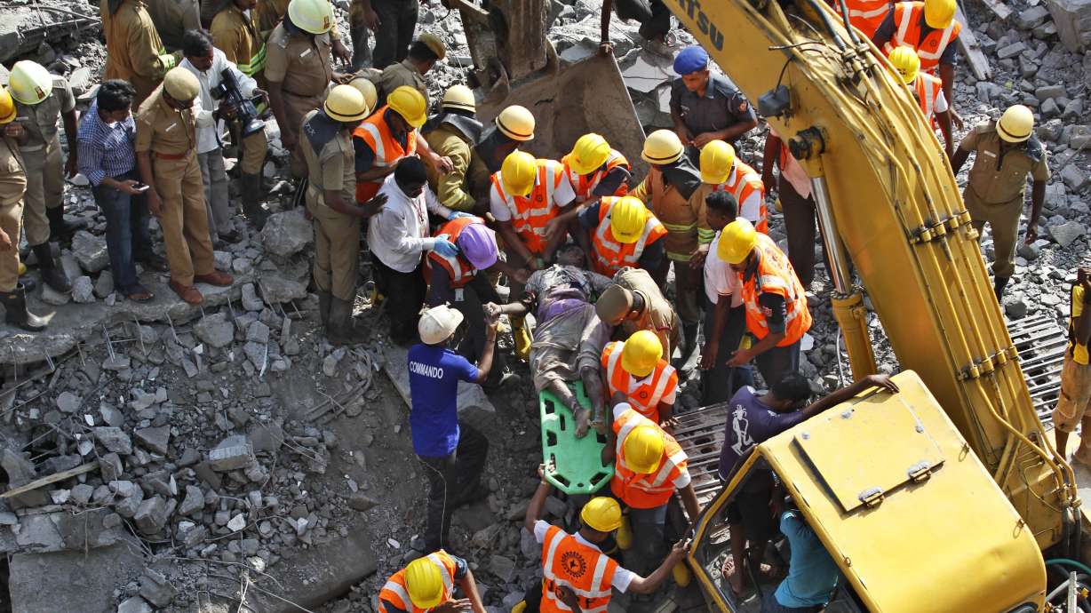 Rescuers dig for survivors in India building ruins