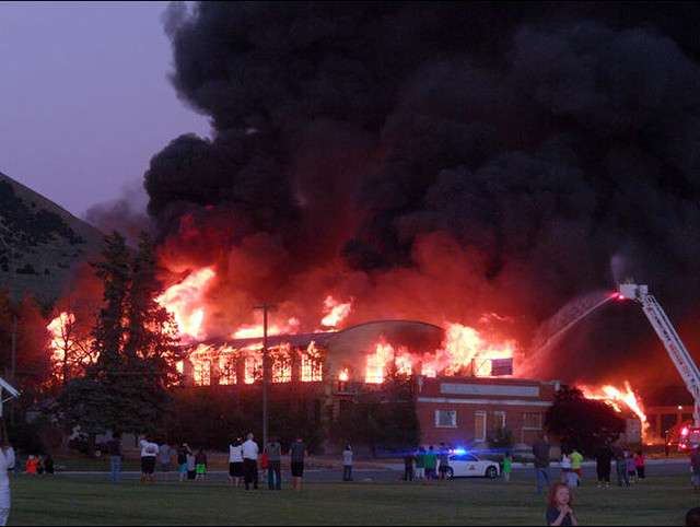 A fire burns at Baron Woolen Mills in Brigham City, Sunday, June 29,
2014. (Photo: Whitney Ritchie)