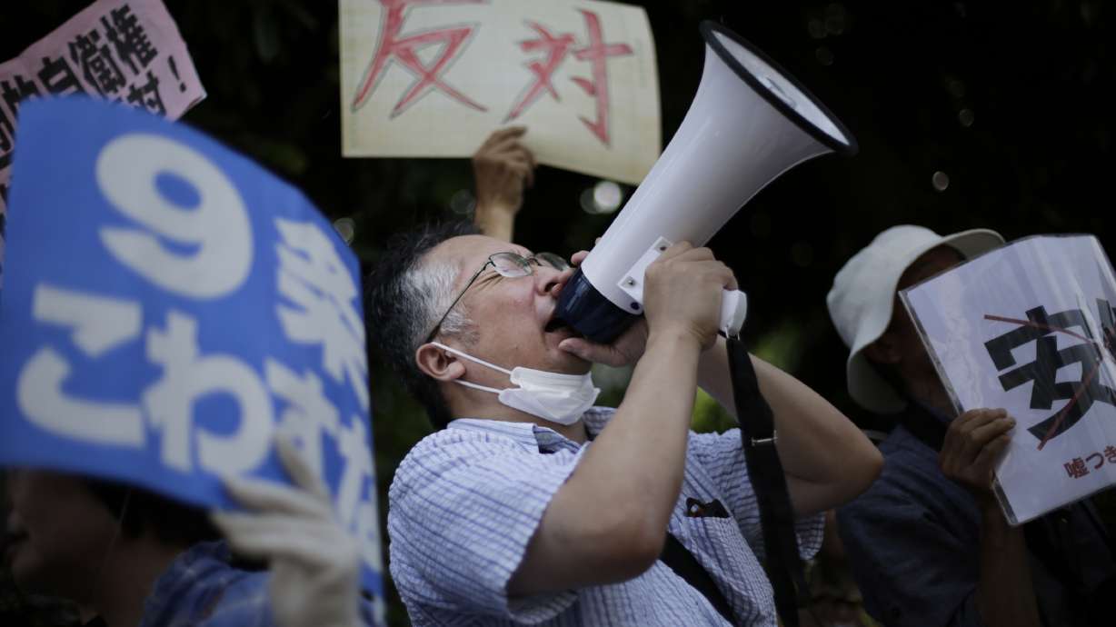 Japan's Cabinet eases post-WWII limits on military