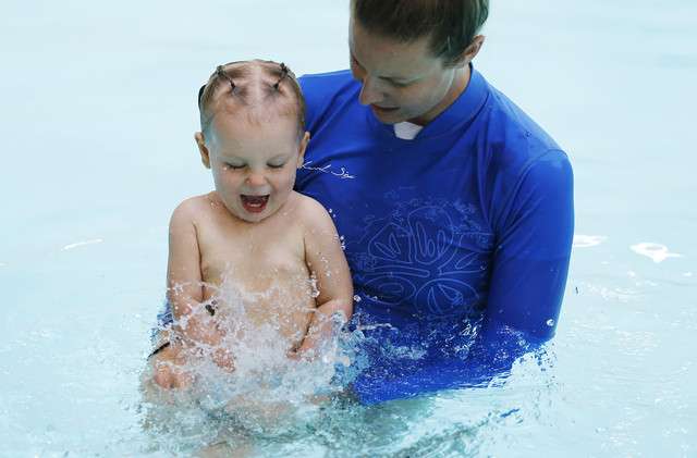 Erin O'Connor teaches Infant Swimming Resource lessons to 18-
month-old Ripley Nicholson at a pool in Midvale Tuesday, June 24,
2014. The lessons teach toddlers to float on their backs and swim
briefly until help arrives or they reach a pool edge.