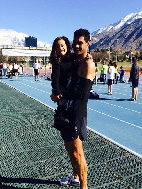 Toni Vakaafi holds his daughter after a first-
place finish at the 2014 Rex Lee Run. (Photo:
Monica Vakaafi)