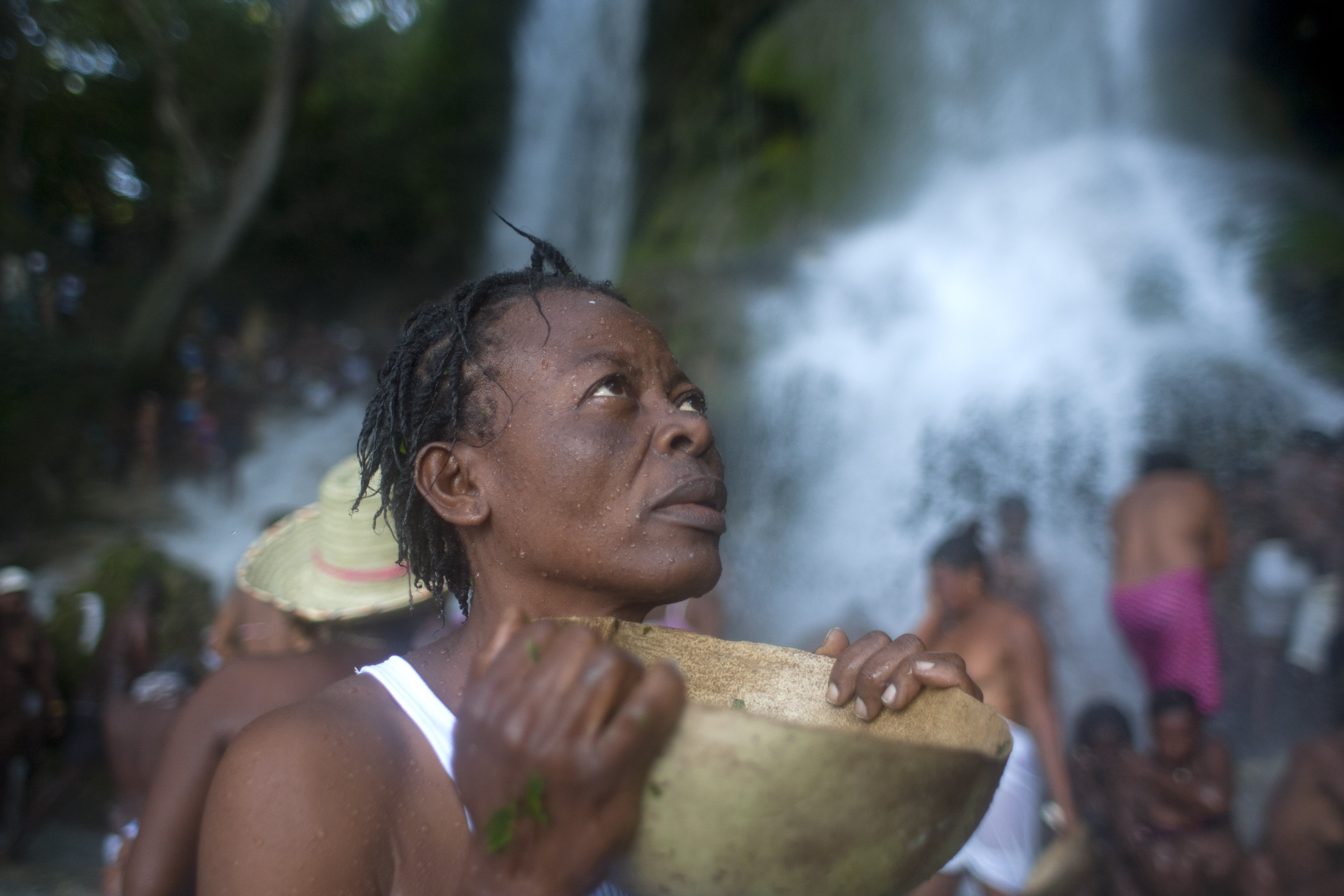 Haitians trek to waterfall to venerate saint