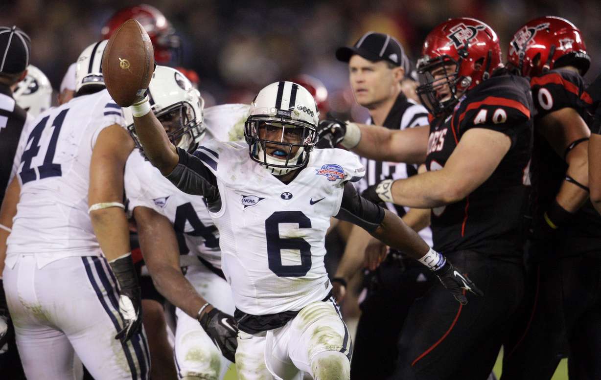 Brigham Young Cougars defensive back Jordan Johnson (6) comes up
with a San Diego State Aztecs fumble which lead to a touchdown
during the Poinsettia Bowl in San Diego Thursday, Dec. 20, 2012.
Johnson's return to the secondary bolsters a unit that was 16th in the
country in team passing efficiency defense in 2013.
