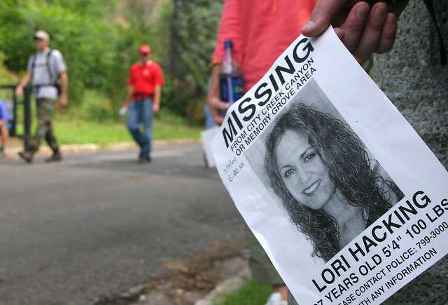 FILE - Volunteer Richard Williams holds a flyer of Lori Hacking as volunteers head back from their search. "We just wanted to help," Williams said. (Ryan Long, Deseret News, File)