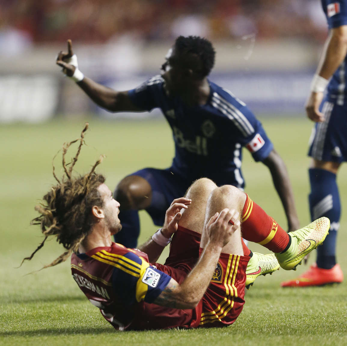 Real Salt Lake midfielder Kyle Beckerman (5) falls after a collision in
Sandy on Saturday, July 19, 2014. The game ended in a 1-1 tie.