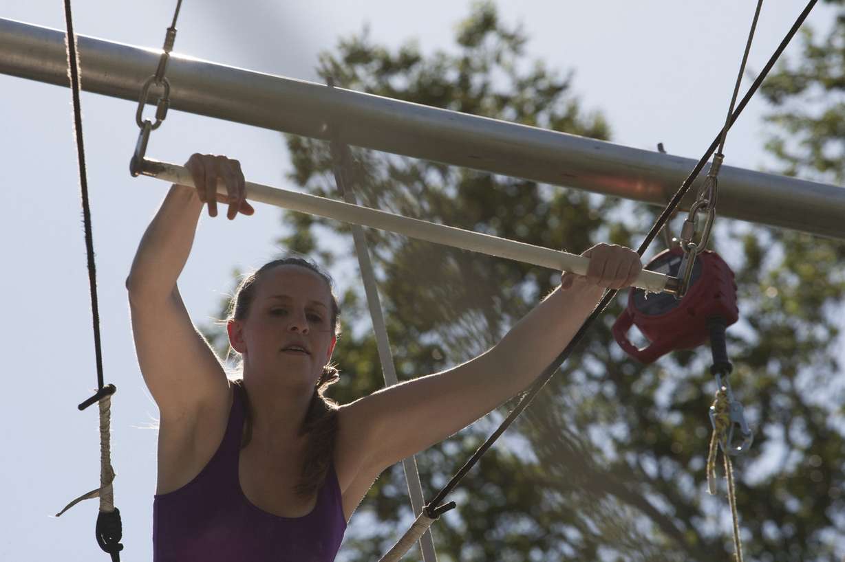Tara Olson prepares to fly during a class with Utah Flying Trapeze in Pioneer Park, Wednesday, July 23, 2014. (Photo: Michelle Tessier, Deseret News)