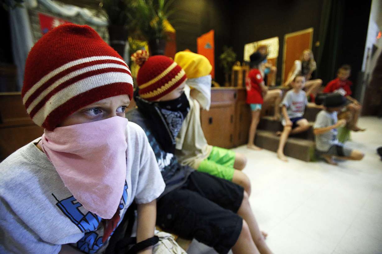 Students rehearse to present "The Dragon Flame" at the Madeleine Choir School in Salt Lake City, Friday, July 25, 2014. At left is Alex Yannelli.