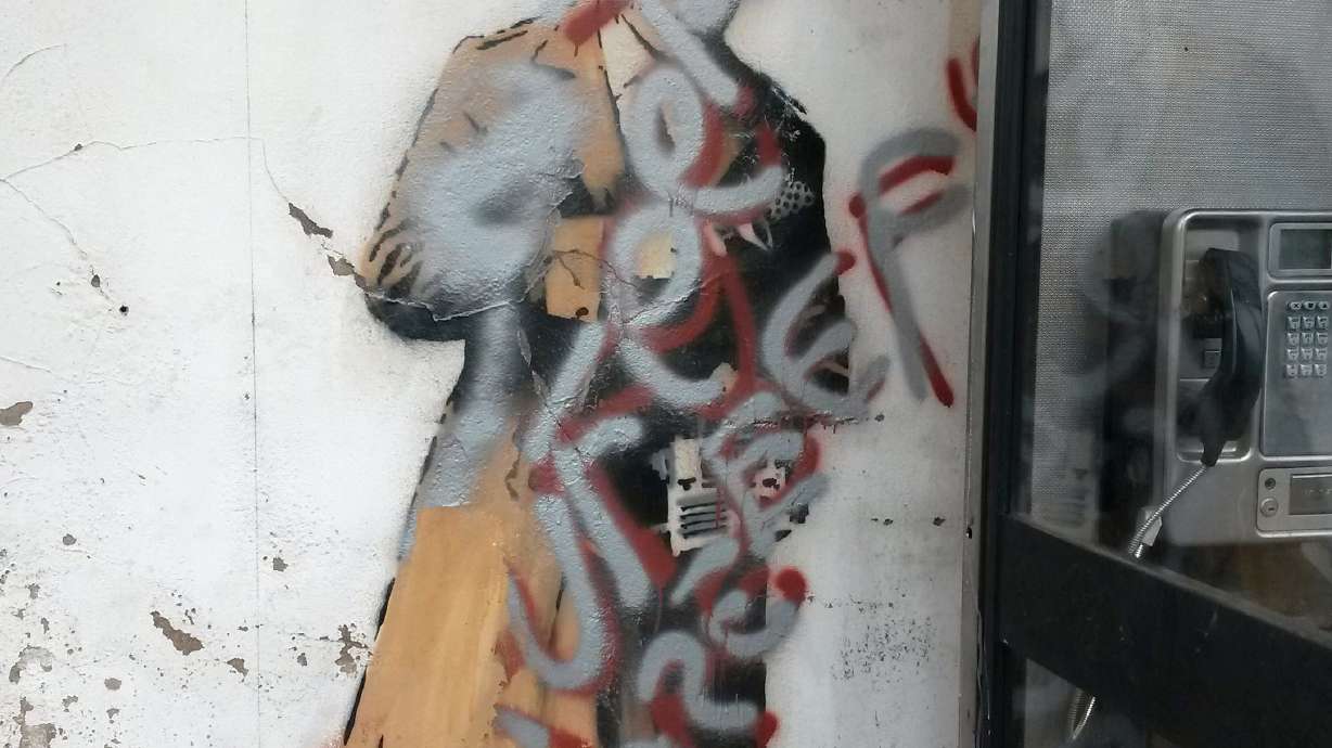 Banksy's 'Spy Booth' artwork defaced