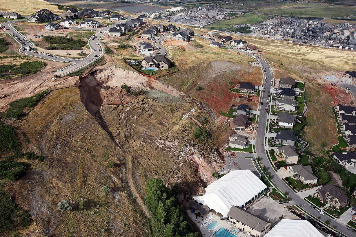 A home is destroyed and a tennis club damaged by a slide in North Salt Lake, Tuesday, Aug. 5, 2014.