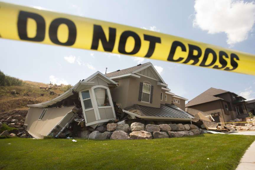 A home near 739 Parkway Drive rests after being destroyed by a landslide, Wednesday, Aug. 6, 2014.
Credit: Michelle Tessier/Deseret News
