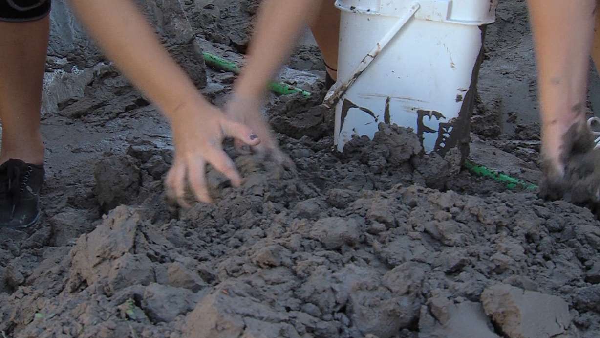 Cheerleaders, convicts help cleanup flood damage in Helper