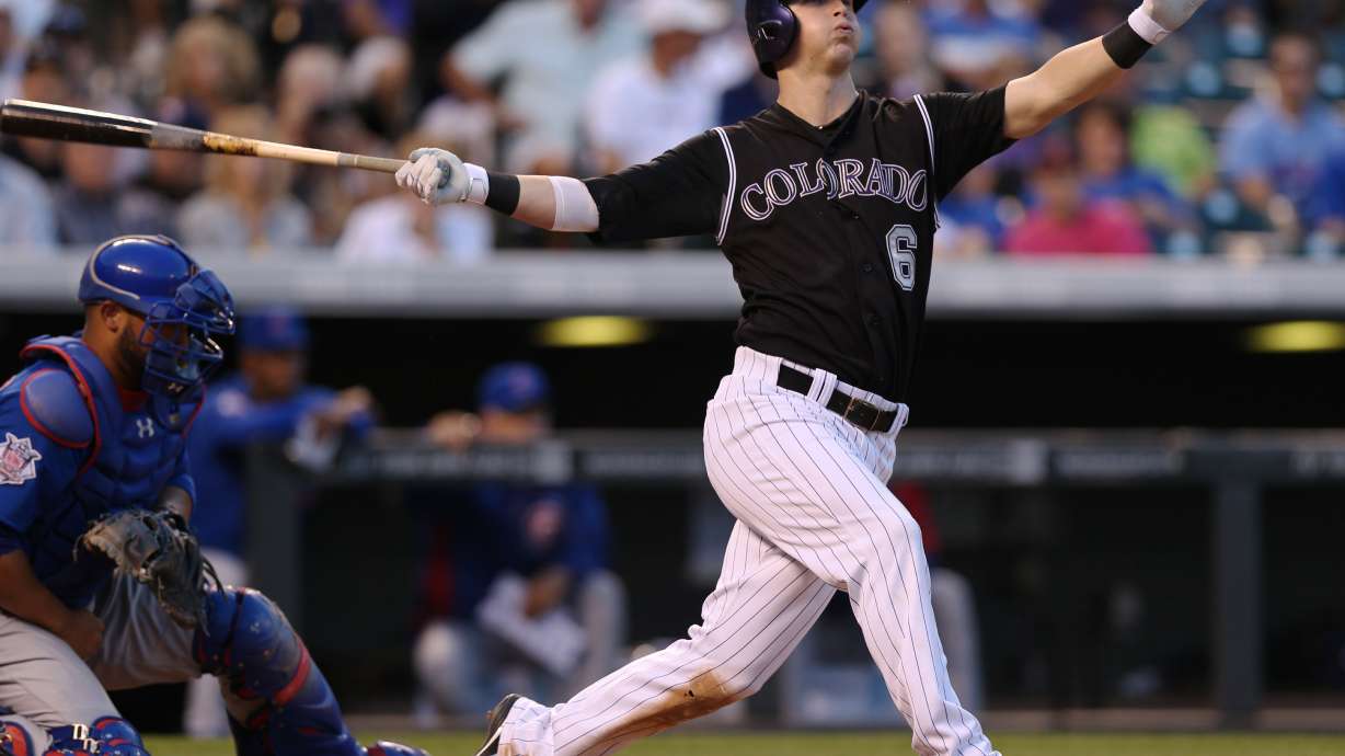 Gonzalez homers as Rockies rout Cubs, 13-4.
