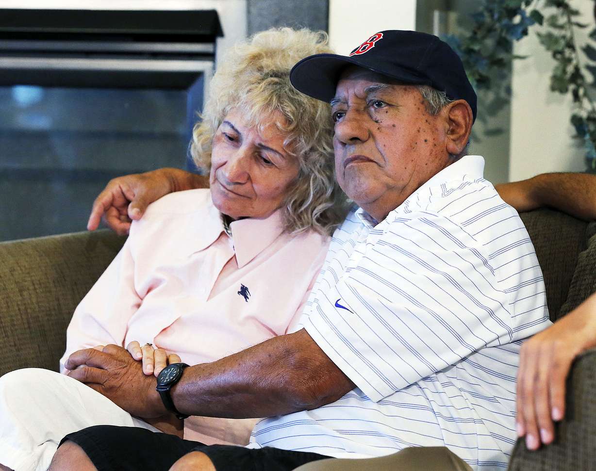 Edgardo and Elena Utrilla listen during a press conference detailing help for the Utrilla family in North Salt Lake, Friday, Aug. 8, 2014. The Utrilla's lost their home to a landslide.