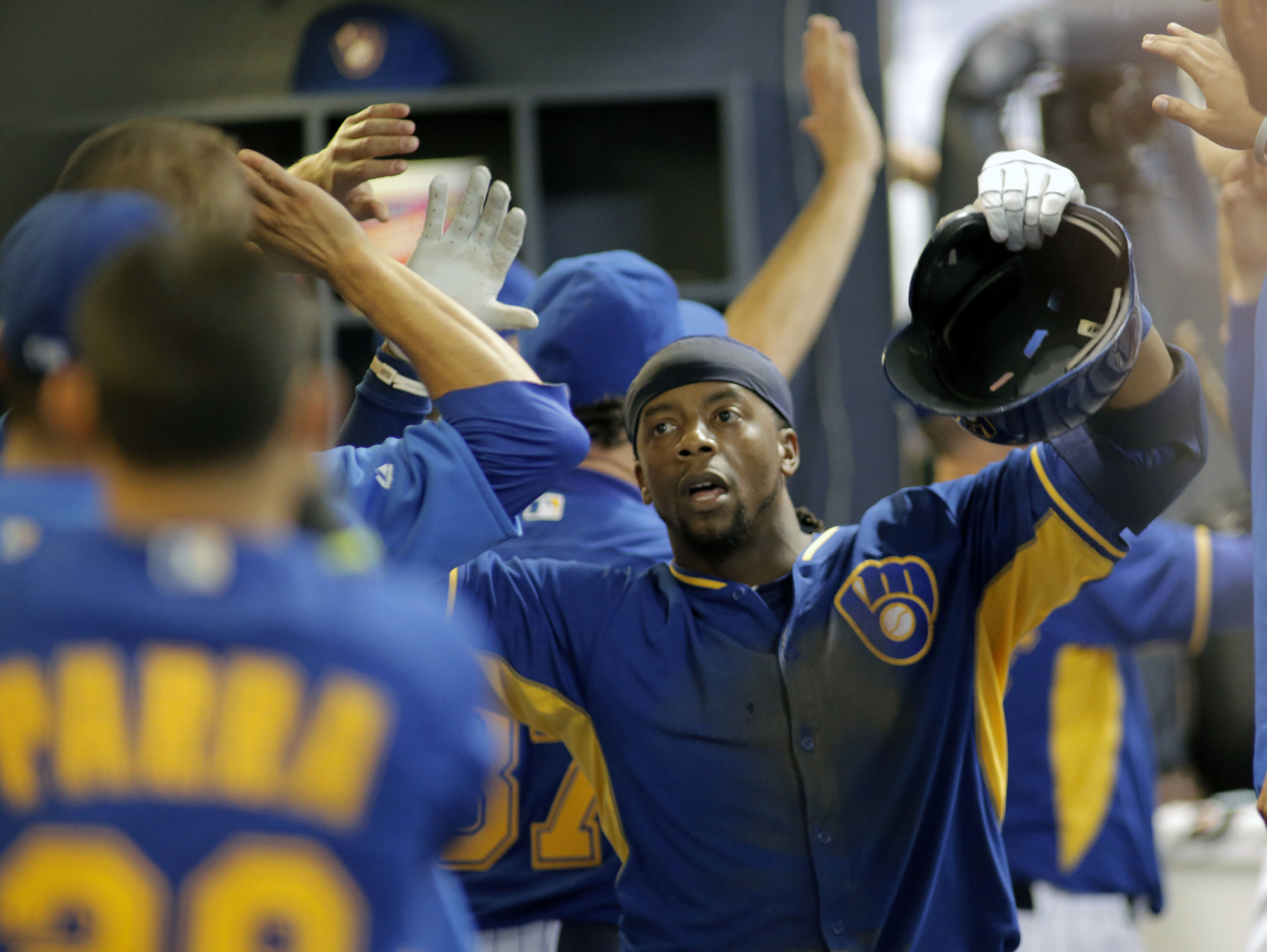 Weeks leads Brewers over Dodgers 9-3