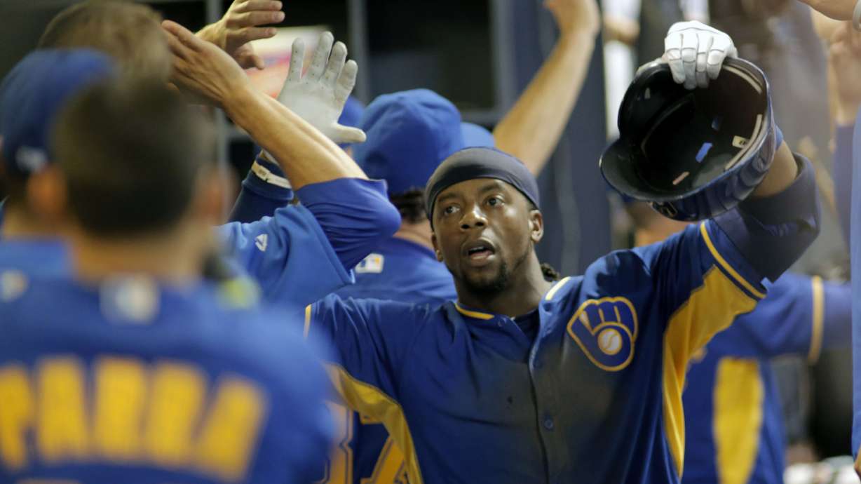 Weeks leads Brewers over Dodgers 9-3