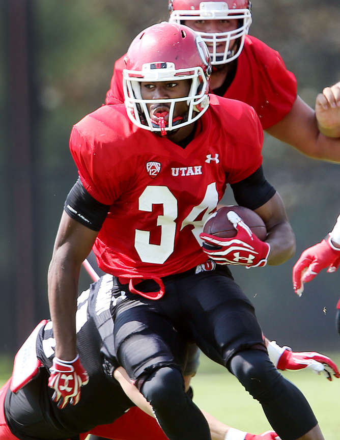 Bubba Poole looks for running room as Utah practices Friday, Aug. 8, 2014, at the University of Utah. (Scott G Winterton, Deseret News)