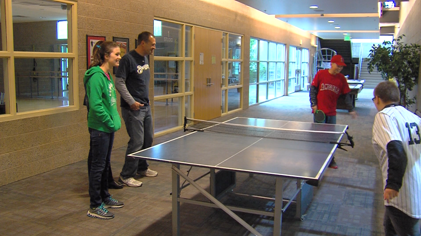 Sophie was adopted by Bob LaForge (center) and his wife, Cami LaForge (no pictured). She now has a sister and brother too.