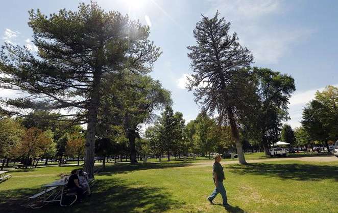 John Estes walks through Pioneer Park in Salt Lake City Tuesday, Aug. 12, 2014. Community leaders updated the public on what the city and service providers are doing to address the challenges facing Pioneer Park and the Rio Grande neighborhood.