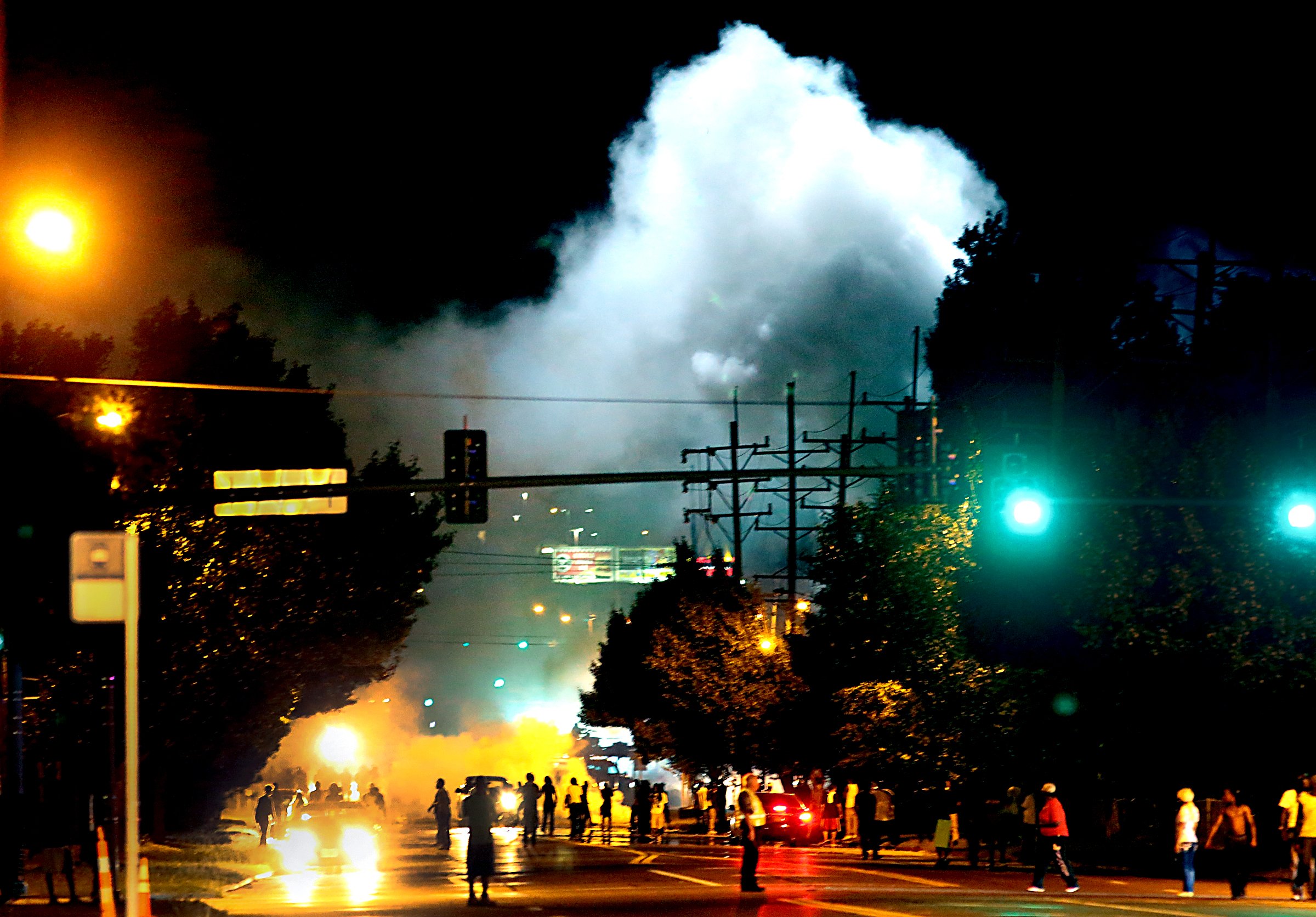 Police images fuel outrage in St. Louis and beyond