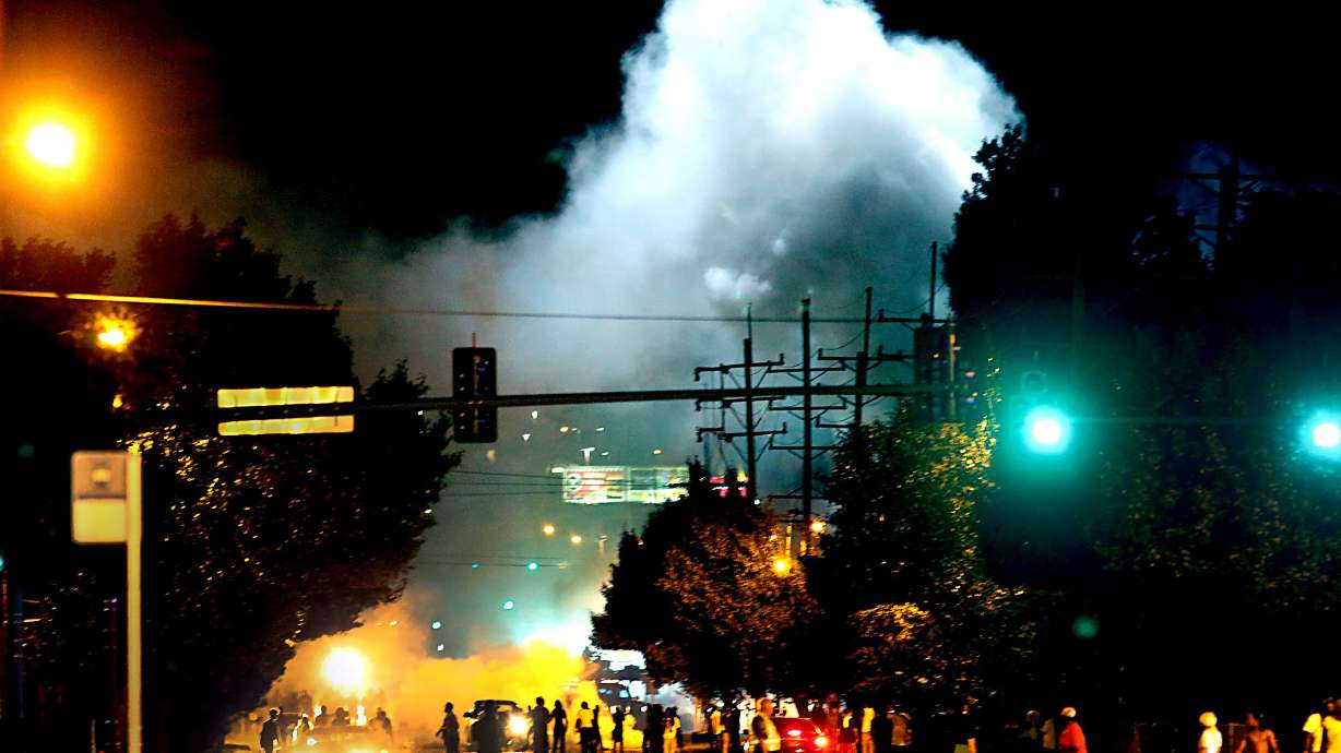 Police images fuel outrage in St. Louis and beyond