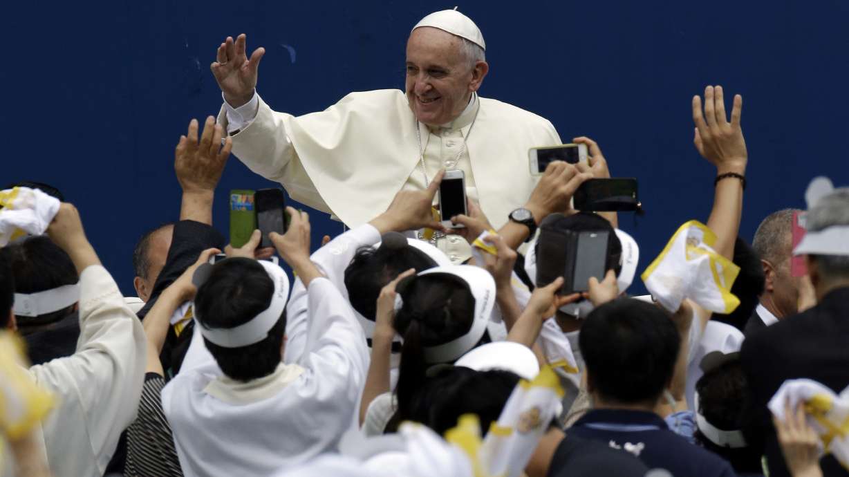 Papal visit underscores religious divide in Koreas