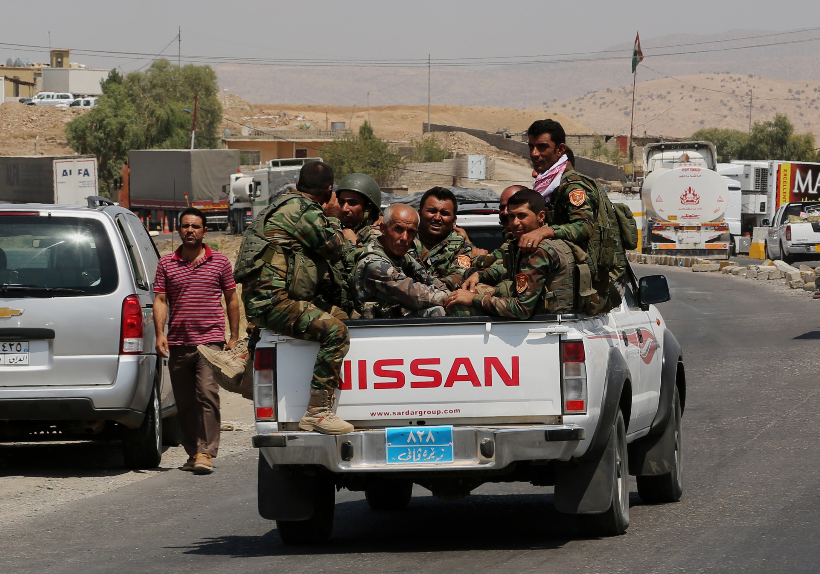 A buyer's market at gun bazaar in Kurdish town