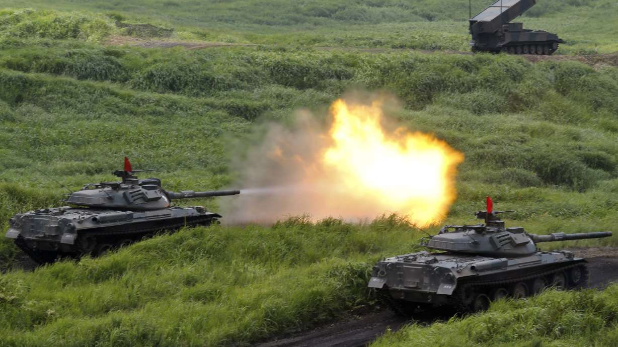 Japan military holds drill as its role expands