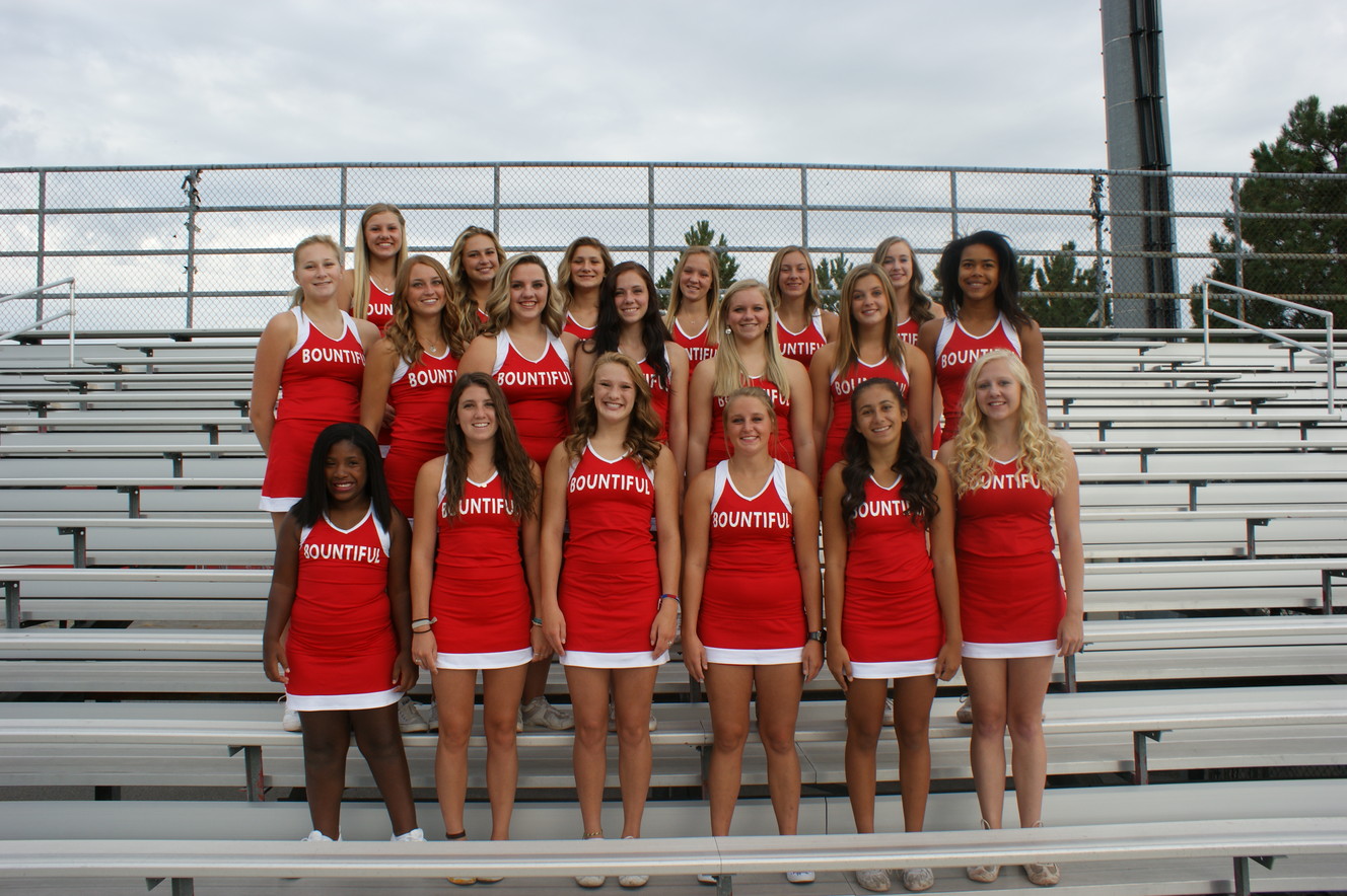 Cheerleaders embrace girl with special needs on team
