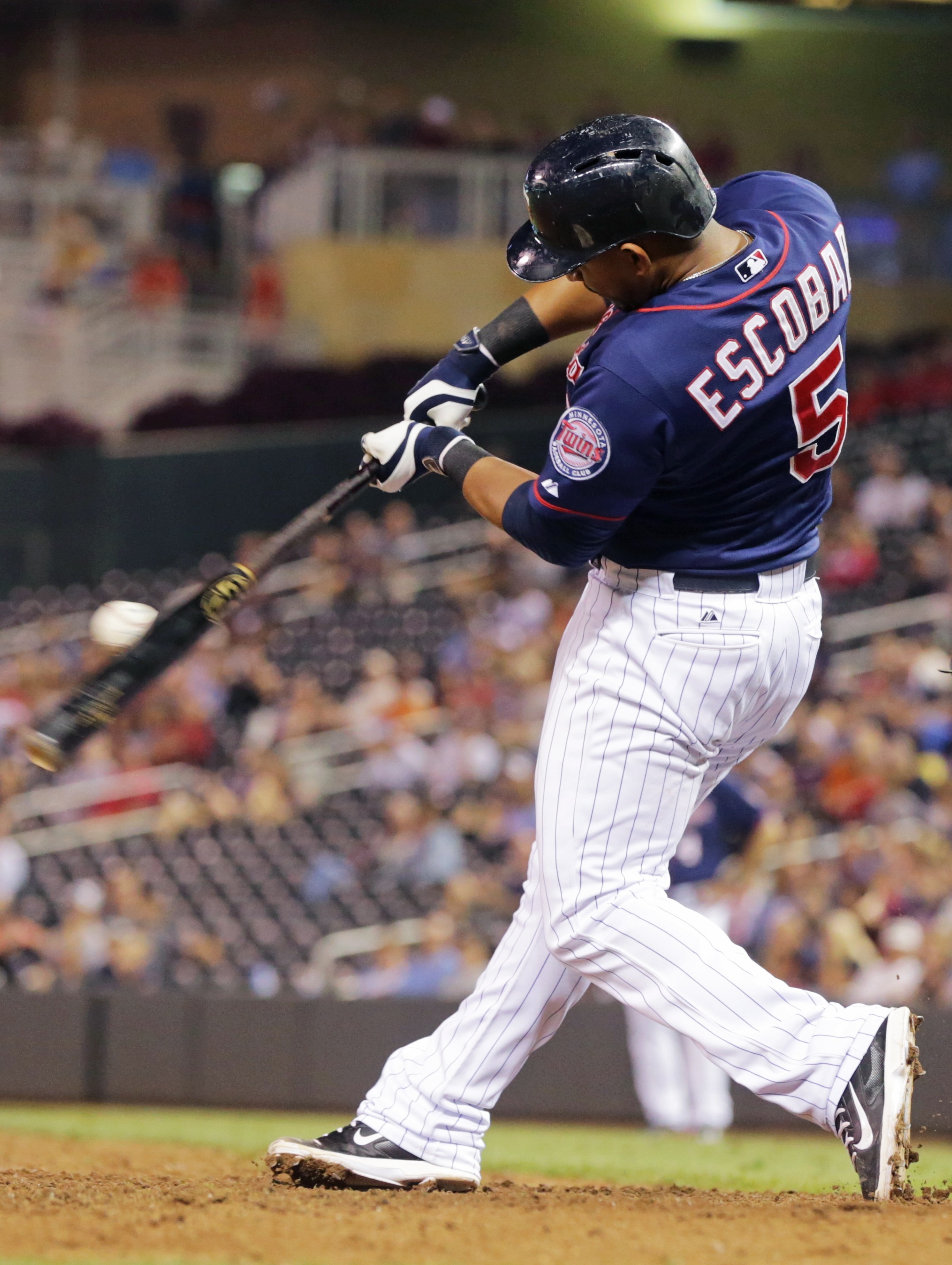 Escobar, Twins bat around twice, pound Tigers 20-6