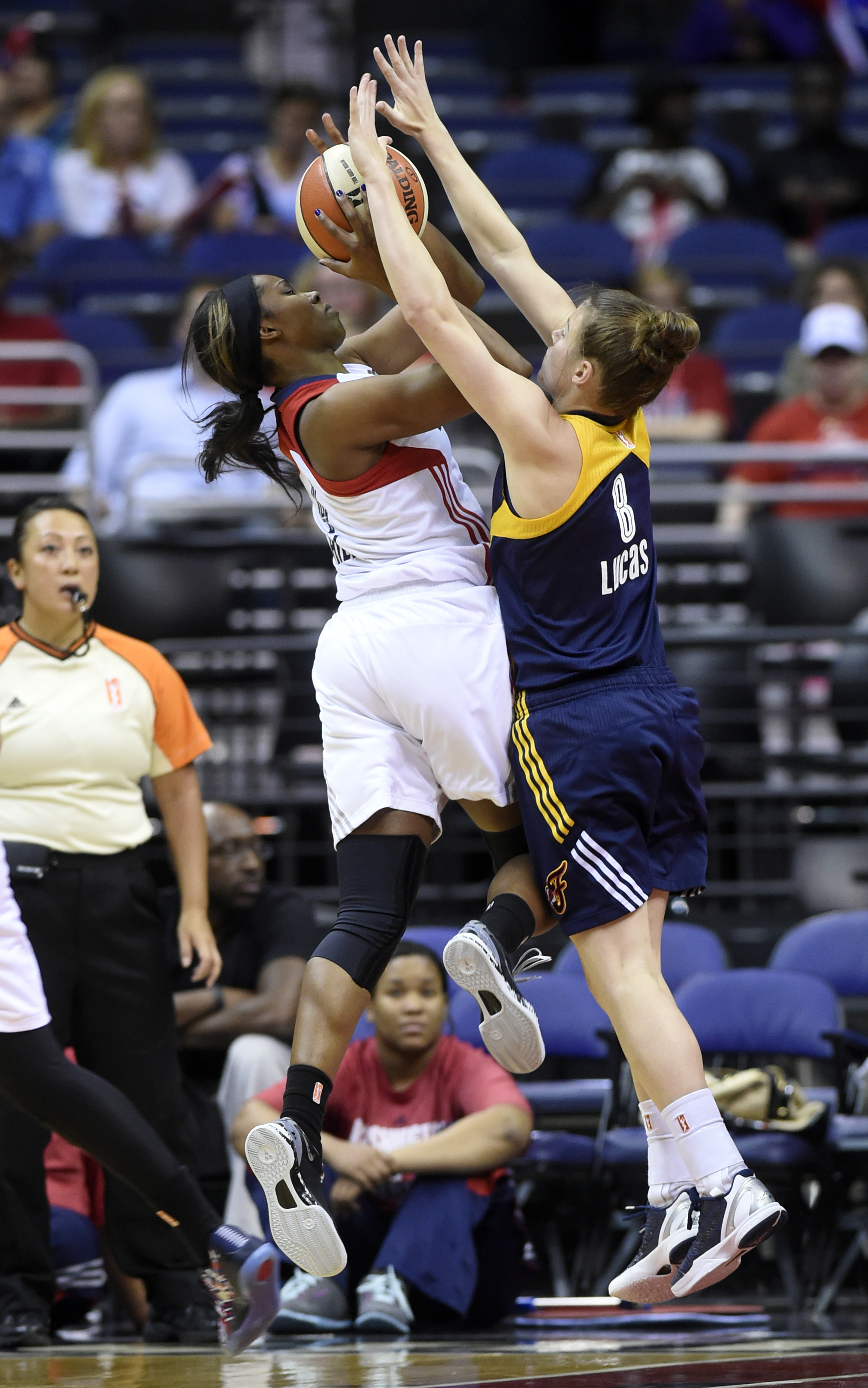 Catchings scores 26, Fever advance past Mystics