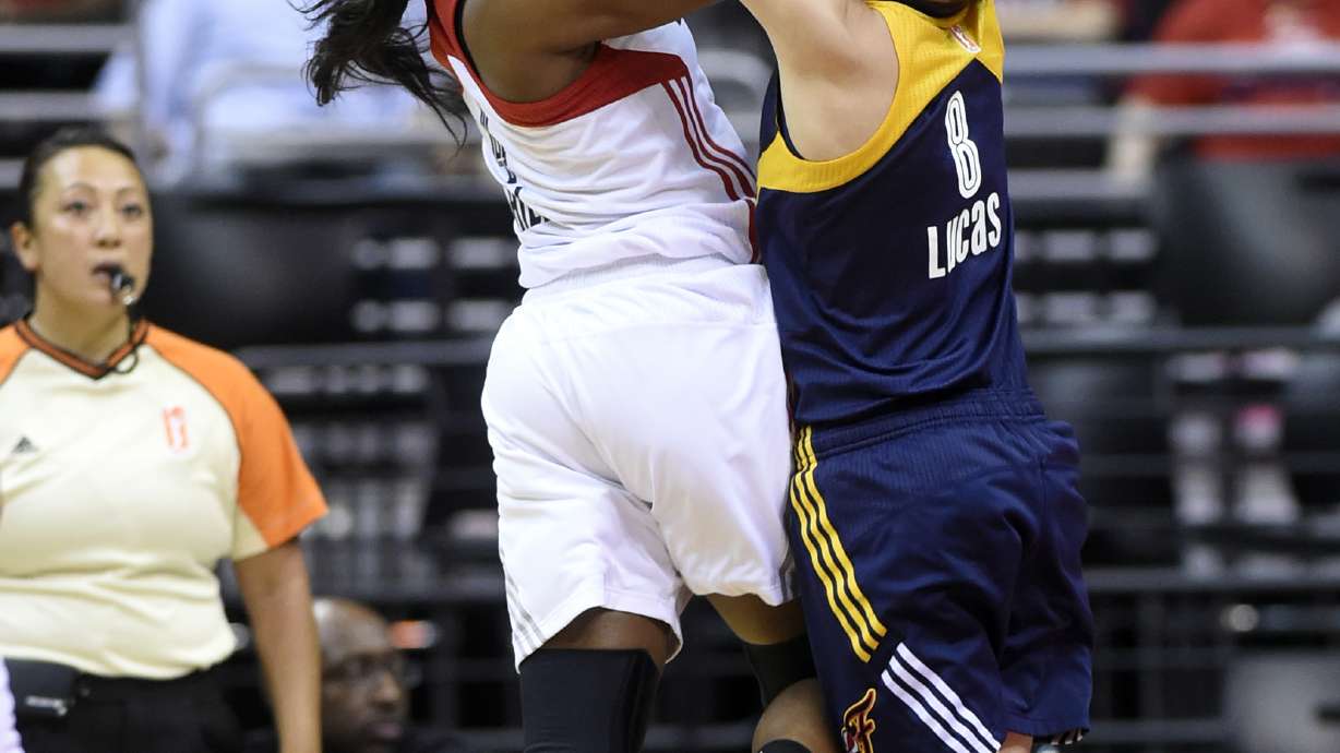 Catchings scores 26, Fever advance past Mystics